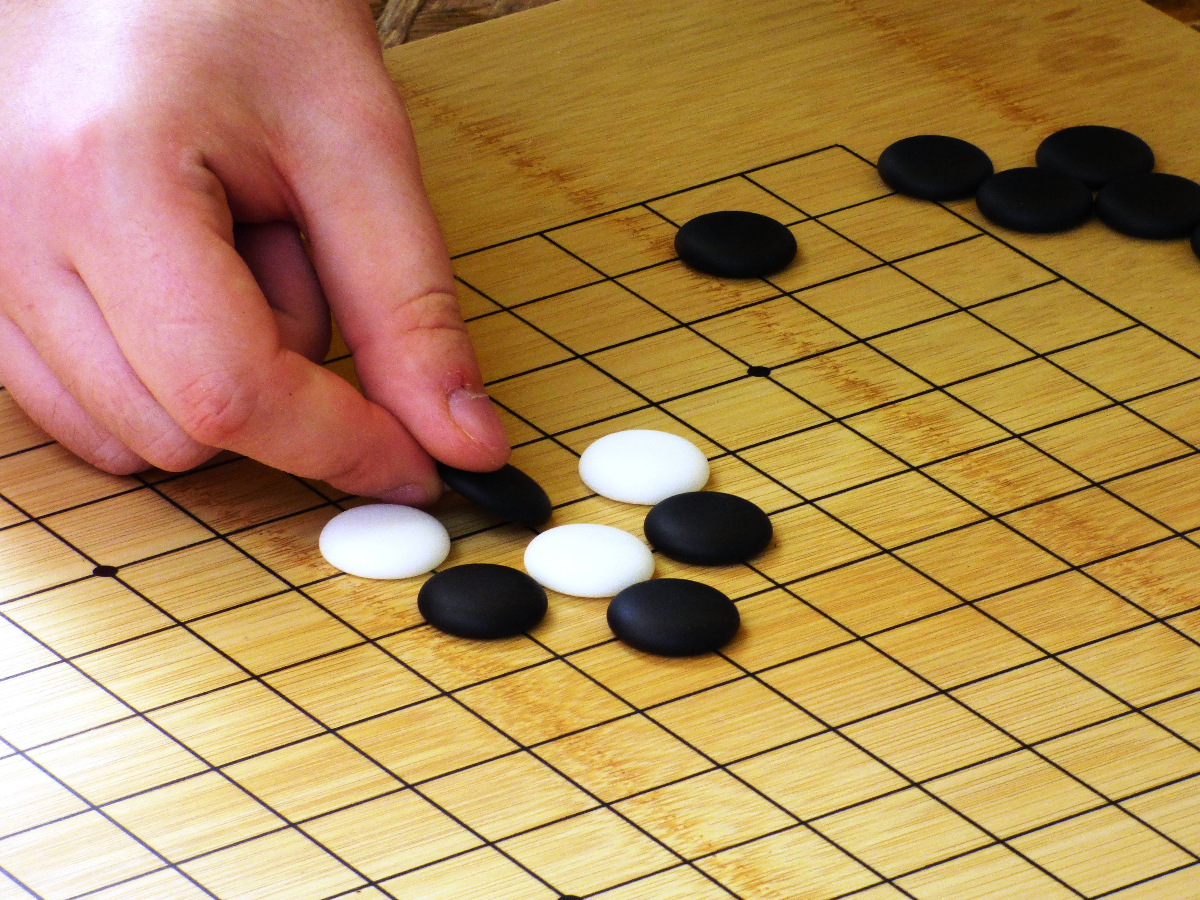 Китайская игра с камнями. Игра го Япония. Настольная игра го. Китайская игра го. Японские шашки.